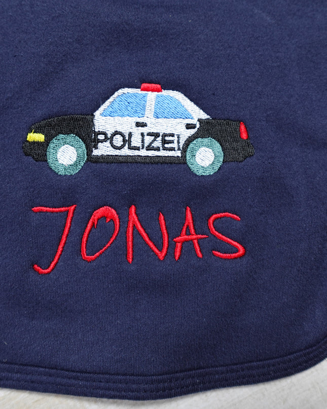 Lätzchen mit einem von uns gestickten Polizeiauto und Namen des Kindes